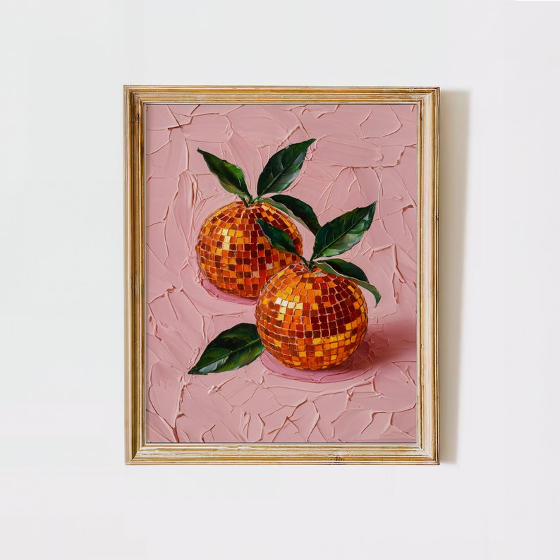 A framed oil painting of two vibrant oranges with a disco ball mosaic pattern, set against a textured pink background. The artwork exudes modern flair and vintage charm, perfect for kitchen or dining room decor.