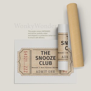 May include: A vintage-style ticket with the text "The Snooze Club" and "Because 5 More Minutes Matter" in red text. The ticket has a torn edge and a red number "54321...ZZZ" printed on the left side. The ticket is printed on a brown paper background.