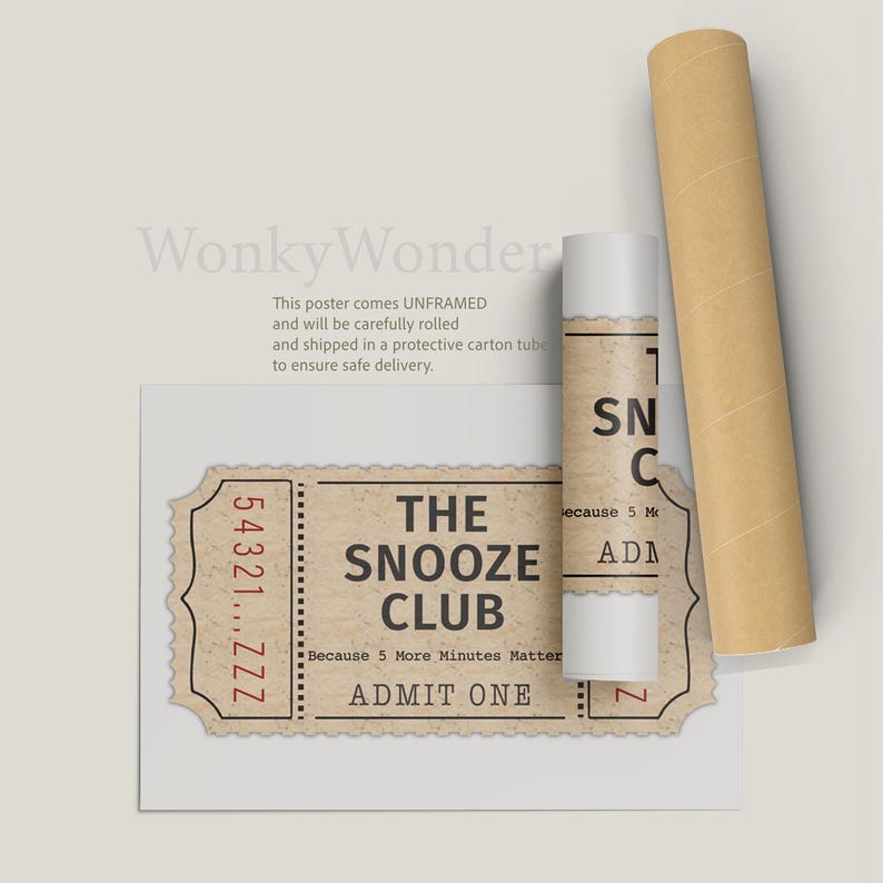 May include: A vintage-style ticket with the text "The Snooze Club" and "Because 5 More Minutes Matter" in red text. The ticket has a torn edge and a red number "54321...ZZZ" printed on the left side. The ticket is printed on a brown paper background.