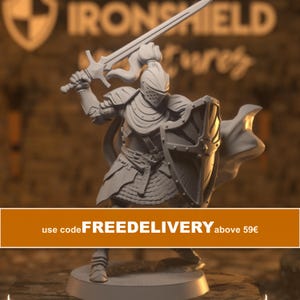 May include: A grey miniature knight figurine standing on a circular base, wearing plate armour and a helmet with a ponytail. The knight holds a long sword raised in the right hand and a shield in the left hand, with a flowing cape behind the figure.