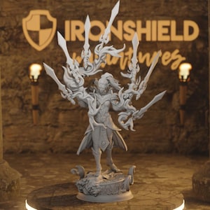 May include: A white 3D printed figurine of a warrior holding multiple swords. The warrior is wearing armor and a flowing cape. The figurine is standing on a base with a swirling design. The background is a stone wall with the text "IRONSHEILD Adventures" on it.