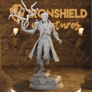 May include: A detailed, gray figurine of a person in a long coat, holding a stylized lightning bolt. The figure stands on a rocky base. The background features the text "IRONSHIELD ventures".