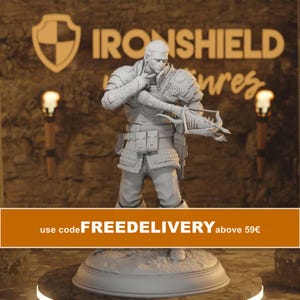 May include: A light gray miniature figurine of a warrior standing on a circular base. The figure wears detailed armor, a textured tunic, and holds a crossbow with both hands. The background features the text IRONSHIELD and a shield icon.