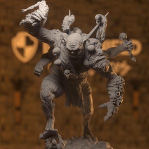May include: A detailed gray figurine of a monstrous creature with multiple arms and a grotesque face. The figure is adorned with skulls and carries a weapon. The creature is posed in a dynamic stance, suggesting action or aggression.