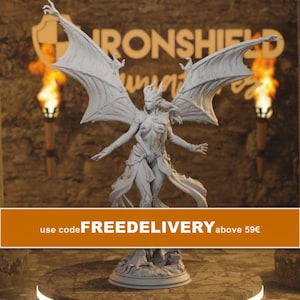 May include: A light gray resin figurine of a winged humanoid creature with horns, standing on a circular base. The figure features large, outstretched bat-like wings, flowing fabric drapery around the waist, and detailed facial features.