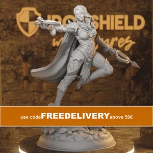 May include: A grey unpainted miniature figurine of a warrior in a dynamic pose, wearing detailed armour and a flowing cape, holding a crossbow in each hand. The figure stands on a circular base with a textured rocky surface, featuring intricate carvings.