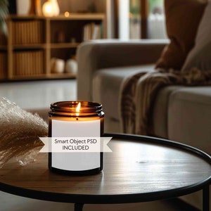 May include: A brown glass candle with a white label that says "Smart Object PSD INCLUDED" is lit and sitting on a wooden table in a living room.