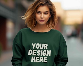 May include: A dark green sweatshirt with the text "YOUR DESIGN HERE" printed in white on the front.