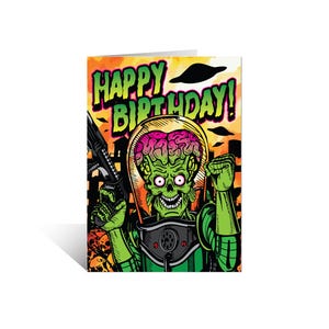 May include: A greeting card featuring a green alien with a large brain, holding a gun and wearing a helmet. The card has a yellow, orange, and red background with the text "Happy Birthday!" in green and yellow letters.