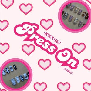 May include: Custom press-on nails with a pink and white heart background. The nails feature a variety of designs, including moons, stars, and abstract patterns. The text "Press On Nails" is written in white on a pink background.