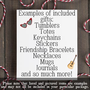 May include: A white card with the text "Examples of included gifts: Tumblers, Totes, Keychains, Stickers, Friendship Bracelets, Necklaces, Mugs, Journals, and so much more!" Red and white string surrounds the card.
