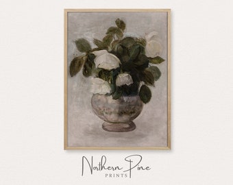 May include: A framed vintage-style print featuring a still life of white roses in a decorative vase. The artwork has a muted color palette with a focus on the flowers and foliage. The print is labeled "Northern Pine PRINTS".