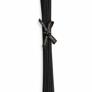 May include: A bundle of black diffuser reeds tied with a black ribbon. The ribbon is printed with the words "Moose Scents" in gold lettering. The reeds are arranged vertically against a white background.