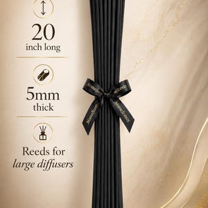 May include: A bundle of black reed diffuser sticks tied with a black ribbon featuring the text MooseScents. The sticks are 20 inches long and 5mm thick, designed for large diffusers. The text 20 inch long, 5mm thick, and Reeds for large diffusers is visible.