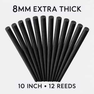 May include: A set of 12 black cylindrical reeds arranged in a fan shape. Each reed has an 8mm diameter and a length of 10 inches. The text 8MM EXTRA THICK is printed at the top, and 10 INCH 12 REEDS is printed at the bottom of the image.