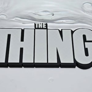3D-Printed The Thing 2011 Logo Stand | Horror Movie Shelf Display | Collectible Memorabilia