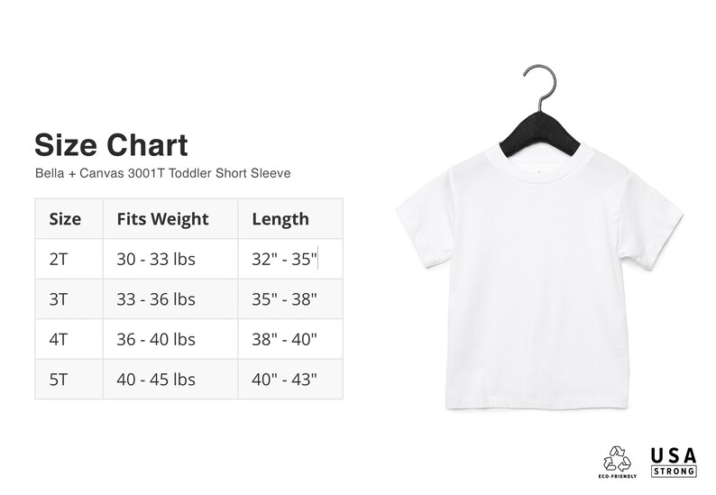 May include: A white toddler short sleeve t-shirt hanging on a black hanger. The image includes a size chart with measurements in inches and pounds for sizes 2T to 5T. The chart also includes the text "Bella + Canvas 3001T Toddler Short Sleeve".