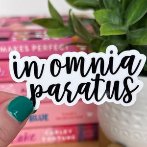 May include: White sticker with black lettering that reads "in omnia paratus".