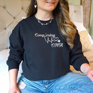 Conquering Cna sweatshirt, Certified Nursing Assistant, Nurse Sweatshirt, Caduceus, CNA Nurse gift, Custom CNA Shirt, CNA Appreciation Gift