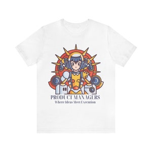 May include: White t-shirt with a cartoon illustration of a female character in a yellow and blue suit, surrounded by gears and a sun. The text "PRODUCT MANAGERS Where Ideas Meet Execution" is printed below the illustration.