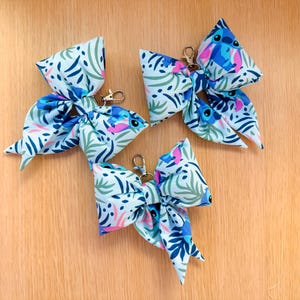 May include: A handmade wooden sign with the text "Welcome to our home" in a handwritten style. The sign is painted white with a dark stained frame. A small green plant is placed on the sign.