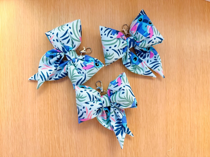 May include: A handmade wooden sign with the text "Welcome to our home" in a handwritten style. The sign is painted white with a dark stained frame. A small green plant is placed on the sign.