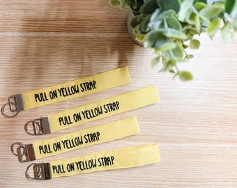 Pull on Yellow Strap Embroidered Wristlet | Handmade Disney Theme Park-Inspired Keychain