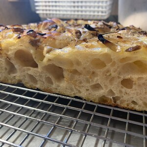 Our famous high hydration focaccia bread made from our sourdough starter