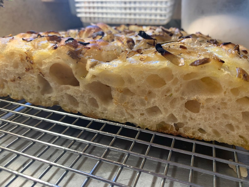 Our famous high hydration focaccia bread made from our sourdough starter