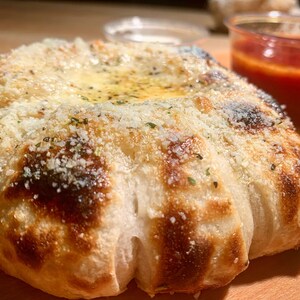 Puffy and chewy garlicky cheese pull apart monkey bread made from our starter