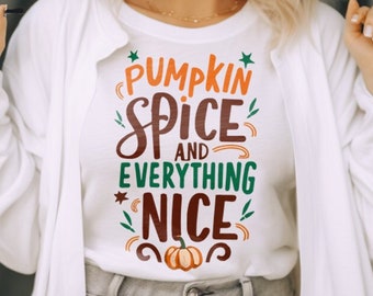 May include: White t-shirt with a graphic print that says "Pumpkin Spice and Everything Nice" with a small pumpkin graphic below the text.