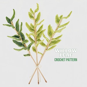 May include: Three crocheted willow leaf sprigs in shades of green, tied together with twine. The sprigs are arranged in a bouquet shape. The text "Willow Leaf Crochet Pattern" is displayed below the sprigs.
