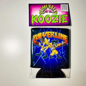 May include: A black and blue koozie with the words "POWERLINE" in orange and yellow, featuring cartoon characters. The top card reads "SLIMEBALLS ART CO." and "KOOZIE" in green and purple.