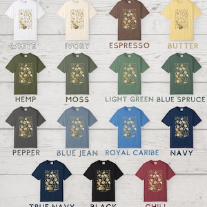 May include: A collection of fifteen short-sleeve t-shirts in various colors including white, ivory, espresso, butter, hemp, moss, light green, blue spruce, pepper, blue jean, royal caribe, navy, true navy, black, and chili, each with a bird graphic.
