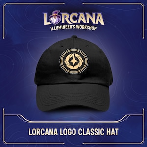 May include: Black baseball cap with a gold and white logo featuring a star and the text "Lorcana Illumineer's Workshop".