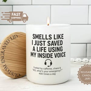 May include: White candle with the text "Smells like I just saved a life using my inside voice." Includes a wooden lid and a "Reusable Candle Jar!" sticker. The candle is a humorous gift.