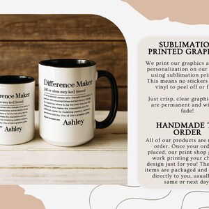 May include: Two white ceramic mugs with black handles and rims. The mugs feature the text "Difference Maker" with a definition and the name "Ashley". The mugs are handmade to order.