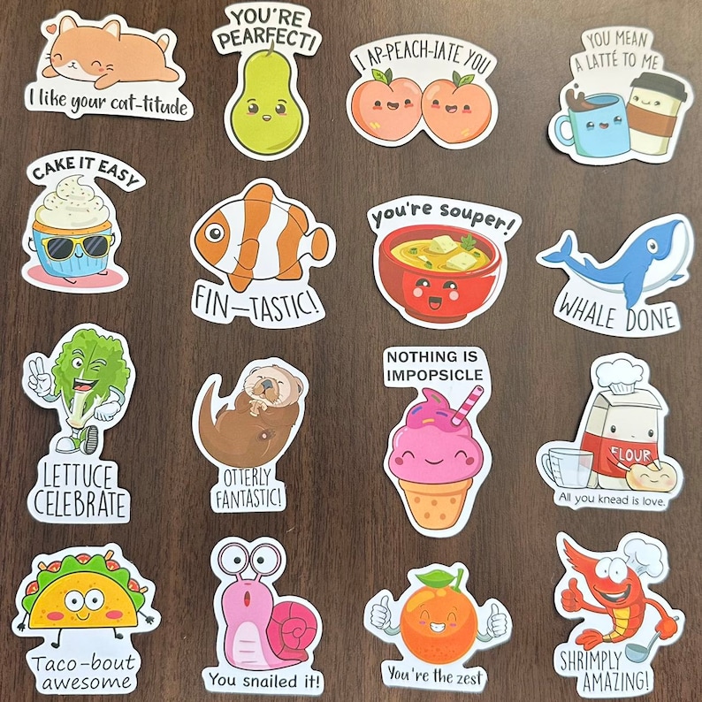 May include: A collection of sixteen die-cut stickers featuring cartoon illustrations of food, animals, and objects with puns. Designs include a cat, pear, peaches, coffee, cupcake, clownfish, soup, whale, lettuce, otter, ice cream, flour, taco, snail, orange, and shrimp.