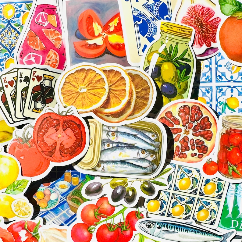 May include: A collection of colourful stickers featuring various images, including fruit, vegetables, fish, playing cards, and a jar of olives. The stickers are arranged in a random pattern on a white background.