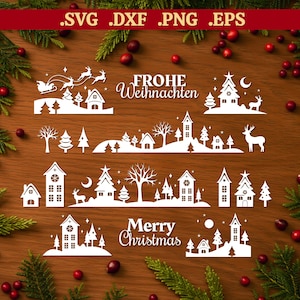 Puede incluir: Recortes blancos con temática navideña que representan casas, árboles, renos y el trineo de Papá Noel. La imagen incluye las palabras "Frohe Weihnachten" y "Merry Christmas". Los recortes están dispuestos sobre una superficie de madera.