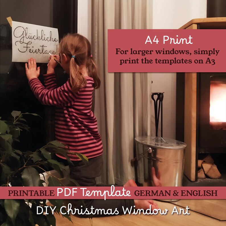 May include: A child in a striped shirt is holding a paper with the words "Gl&uuml;ckliche Feiertage" on a window. The image includes text that says "A4 Print" and "DIY Christmas Window Art". A fireplace and a plant are also visible.