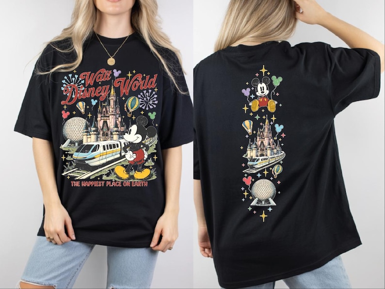 A black t-shirt with a Disney World-themed design, including Mickey Mouse, a castle, and various Disney-related elements.