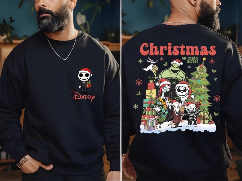 A man wearing a black sweater with a Christmas-themed design on the back.