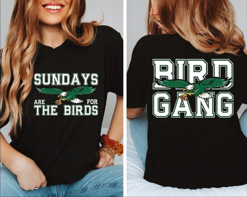 a woman wearing a black shirt with a bird gang on it