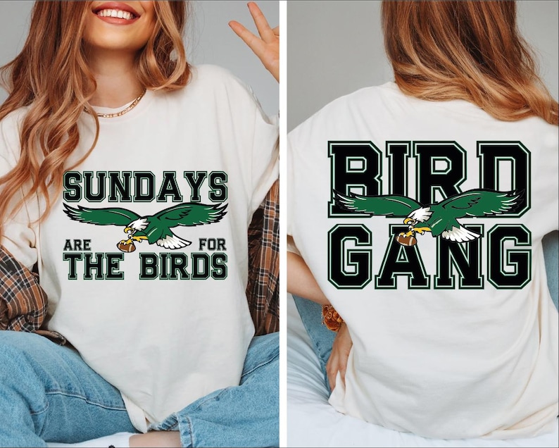 a woman wearing a white shirt with a green bird on it