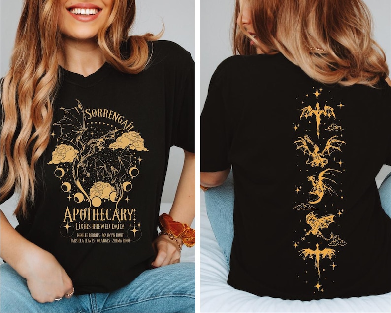 a woman wearing a t - shirt with an image of a dragon on it