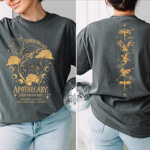 a woman wearing a t - shirt with a graphic on it