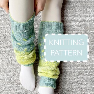 May include: Teal and chartreuse knitted leg warmers with a dotted design. The leg warmers are being pulled up, showing white socks. The image includes the text "KNITTING PATTERN" in a light blue box.