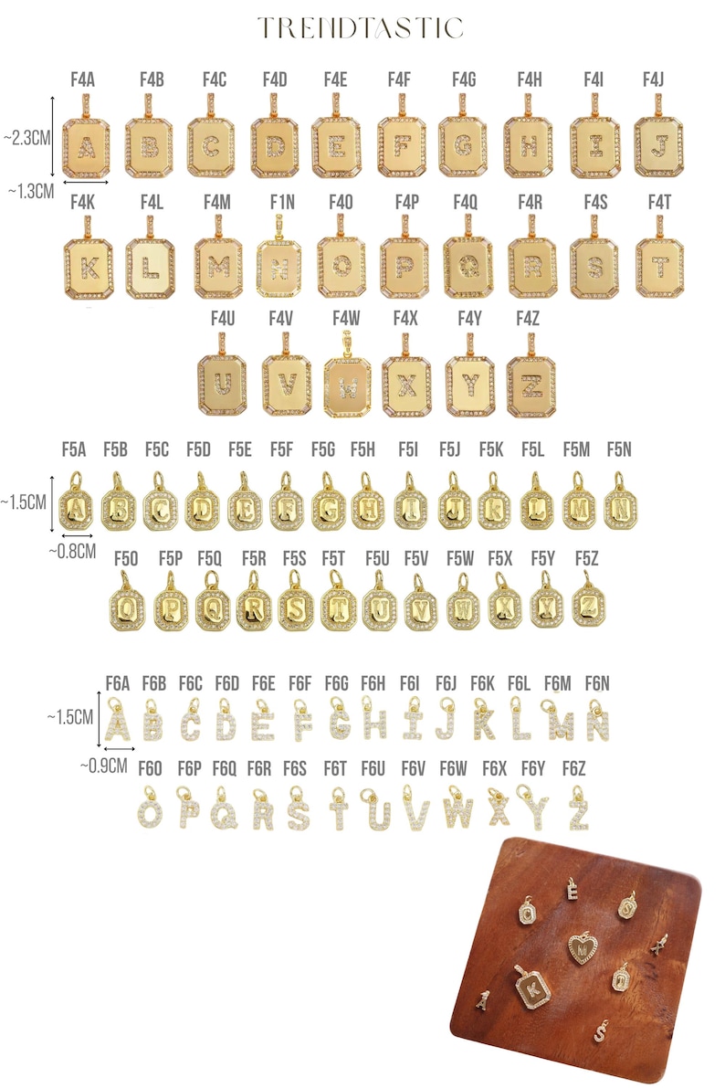 May include: Gold-toned initial pendants with clear crystal accents. The pendants are available in various letter designs, with rectangular and circular shapes. The image also shows the brand name "TRENDTASTIC".