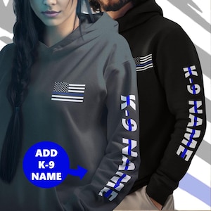 May include: Two hooded sweatshirts with a thin blue line American flag design. One sweatshirt has the flag on the front and the other has the flag and the text "K-9 NAME" on the sleeve.  Add your own K-9 name to personalize the sweatshirt.